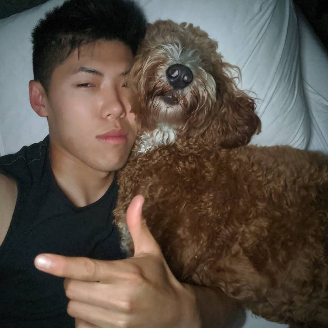 Justin and Peanut cuddling cheek-to-cheek.